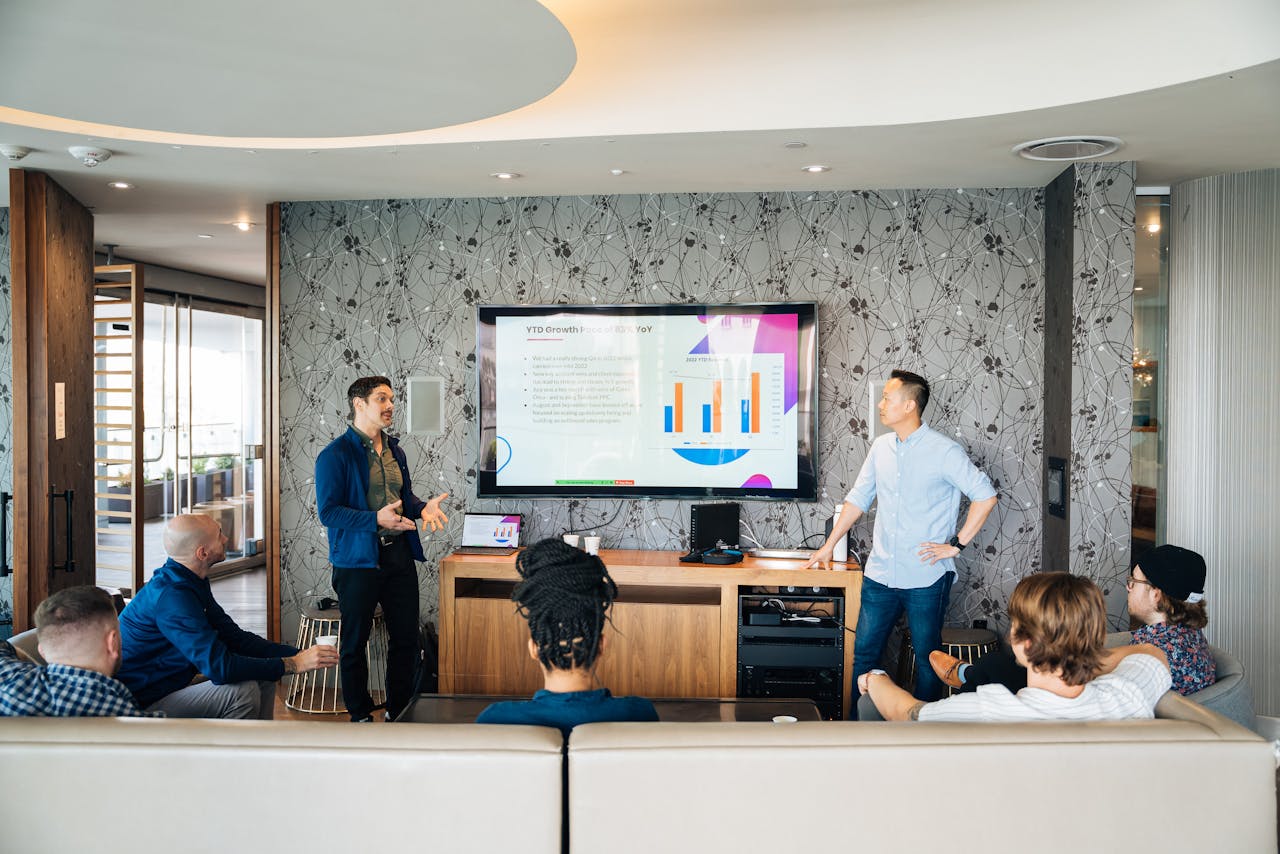 People attending a slide deck presentation, the current slide having too  many words
